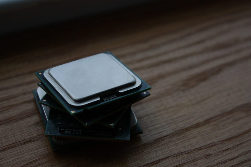 A picture of two CPUs stacked on top of eachother.