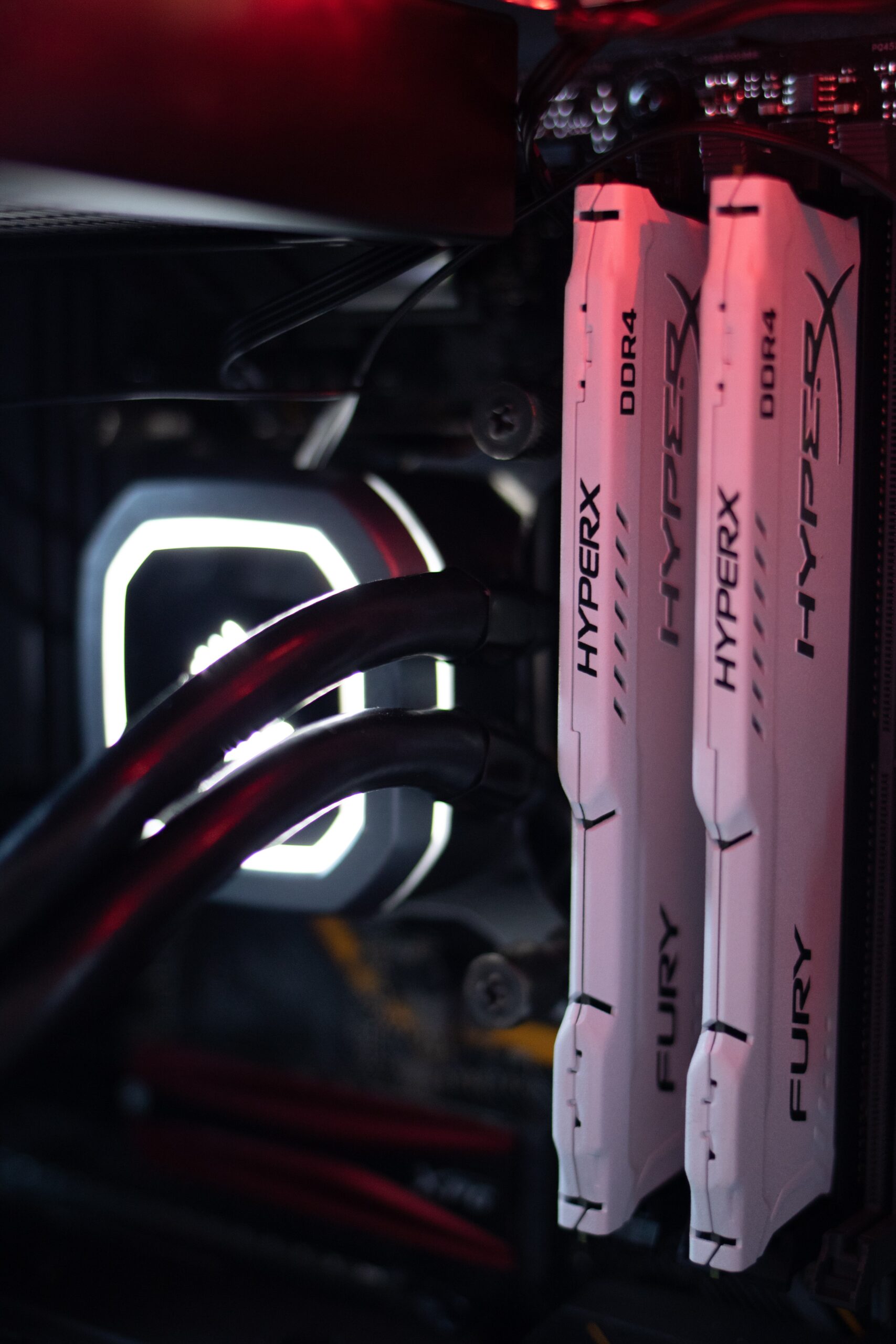 A picture of two sticks of ram installed into a pc motherboard.